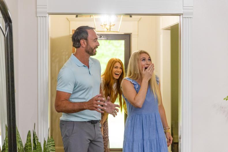 the Jardines reaction to their new living room reveal after renovation, as seen on No Demo Reno.
