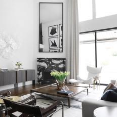 Black and White Living Room With Marble Fireplace