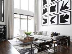 Abstract Black and White Gallery Wall in Living Rom With Fireplace