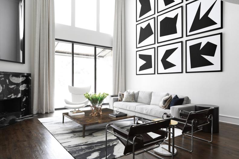 Abstract Black and White Gallery Wall in Living Rom With Fireplace