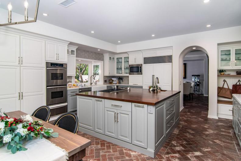 Brick Floor in Transitional Kitchen With Butcher Block Island