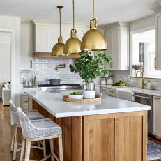 Contemporary Kitchen With Bronze Pendant Lights