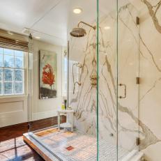 White Farmhouse Bathroom With Marble Accent Wall and Glass Shower