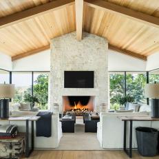 Farmhouse Living Room With Wooden Ceiling and Fireplace