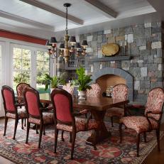 Traditional Dining Room With Stone Fireplace Features a Large Dining Table