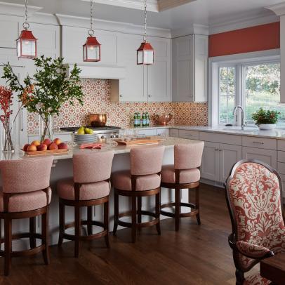 A Red and White Kitchen Features a Tile Backsplash and White Cabinets