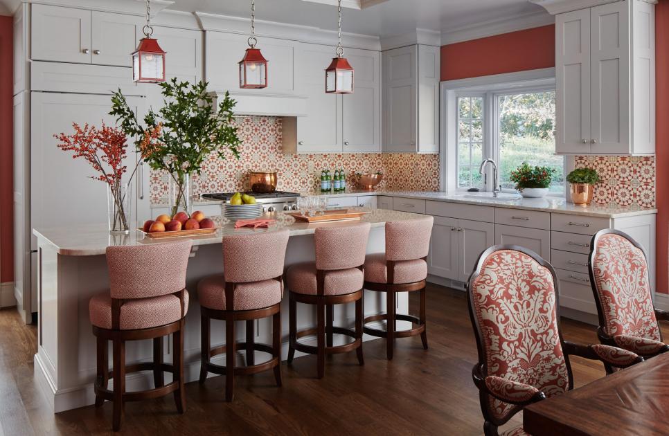 A Red and White Kitchen Features a Tile Backsplash and White Cabinets