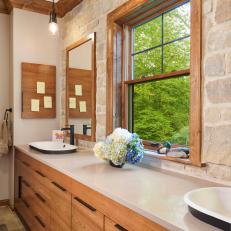 Rustic, White Contemporary Bathroom With Stone Wall and Farmhouse Sinks