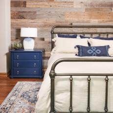 Rustic, Cottage-Style Blue and White Bedroom With Wood Paneling 