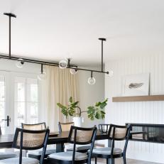 Black and White Transitional Dining Room With Caned Chairs