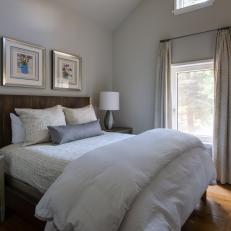 Neutral Bedroom With White Linens and Hardwood Floors
