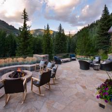 Rustic Stone Terrace Overlooking Conifer Trees and Mountain Views