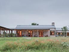 An Expansive Homestead Features Two Main Buildings and Covered Porches 
