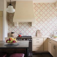 A Bright Kitchen Features a Patterned Backsplash and a Large Island