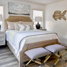 Neutral Coastal Bedroom With Striped Stools
