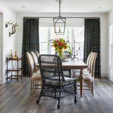 Eclectic Dining Room With Black Curtains