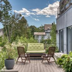 Sustainable Patio With Green Lounge Seating and Natural Landscaping