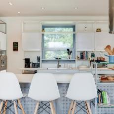Modern, White Kitchen With Gray Pegboard and Modular Shelving