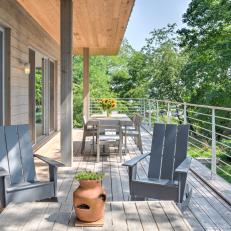 Cedar Deck With Gray Adirondack Rocking Chairs
