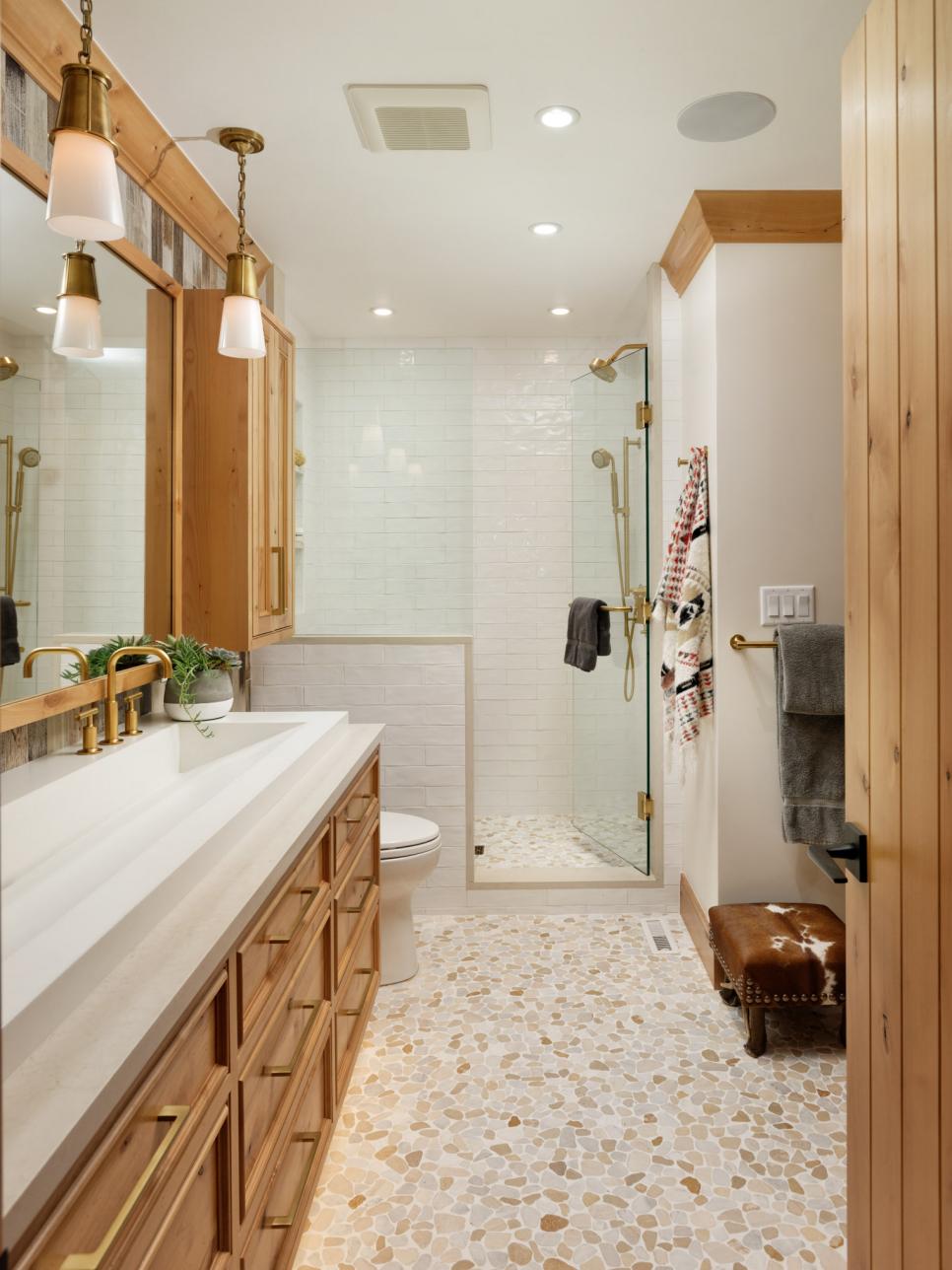 War-Toned Bathroom With Spacious Sink and Wood and Gold Accents | HGTV