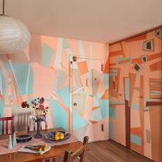 Art Deco Dining Room With Accent Wall Mural
