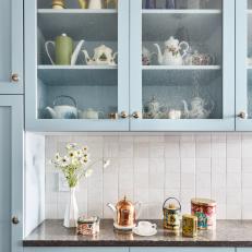 Sky Blue Kitchen Cabinets and Antique Teapots