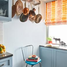 Blue Kitchen Cabinets and Copper Cookware