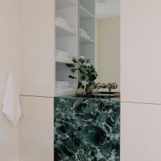 Green Marble Sink and White Bathroom Cabinets