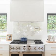 White Kitchen With Clear Marble Backsplash