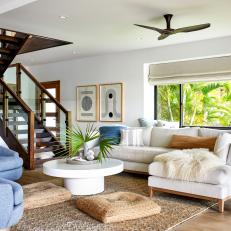 White Bungalow Living Room With Exposed Stairs