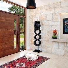 Stone Walls With Cut-Outs for Art in Entryway
