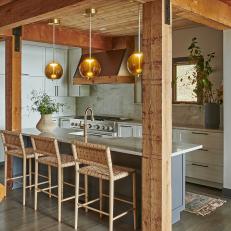 Rustic Open-Plan Kitchen With Woven Barstools