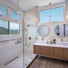 White Bathroom With Two Round Mirrors