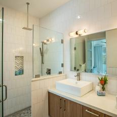 White Bathroom With Striped Shower Niche