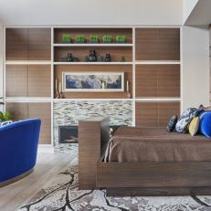 Neutral Modern Bedroom With Curved Blue Sofa