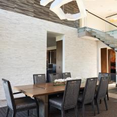 Brown Modern Dining Room With Stone Wall