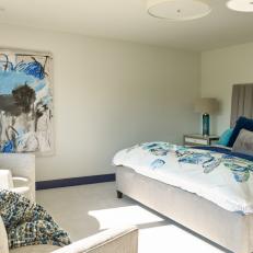Transitional Bedroom With Blue Art