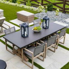 Gray Outdoor Dining Area With Lanterns