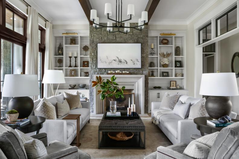 Transitional Living Room With White Shelves