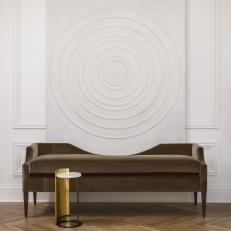Circular Artwork and Brown Bench