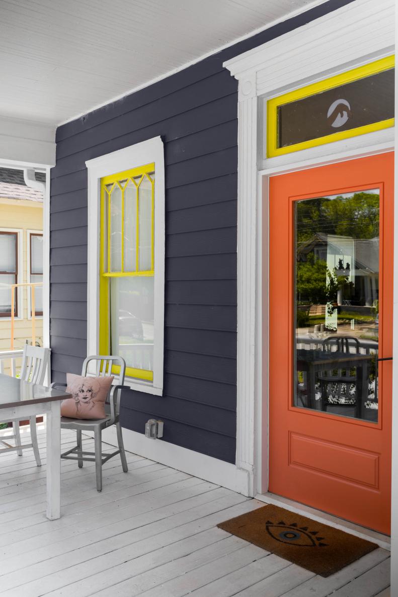 Window frames in a blazing Gen Z yellow and a traffic cone orange front door announce the unique design sensibility coming even before you cross the threshold.