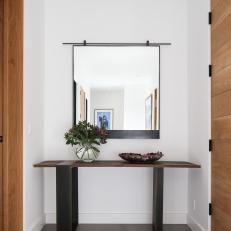 Mirror and Decorative Table in Hallway