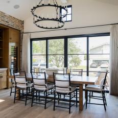 Inviting Dining Space With Brick Accent Wall