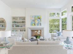 White Living Room, Brick Fireplace, Built-Ins With Wallpaper, Sofa