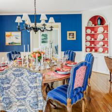 Blue and White Traditional Dining Room With Red Cabinet