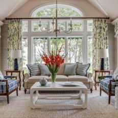 Neutral Coastal Sitting Room With Red Flowers