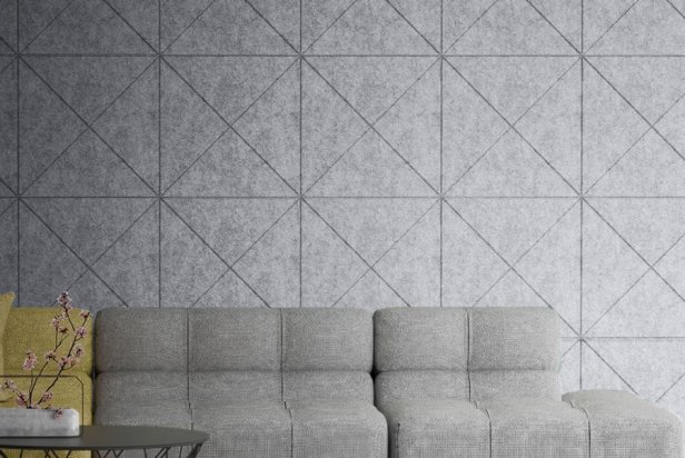 Gray soundproofing panels in a geometric design in a living room.