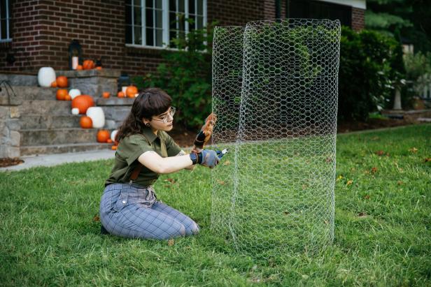 Wire cutters are used to cut chicken wire to be used in a DIY Halloween project.