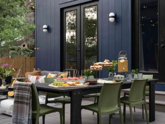 The spacious backyard living space includes a large outdoor dining area with room to gather with friends and family.