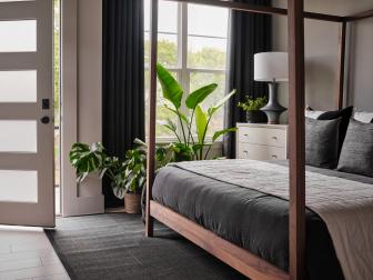 Mornings are slow and easy in the main bedroom suite at HGTV Urban Oasis 2022. Walk out onto a private balcony seating area to enjoy morning coffee before heading out to start the day.